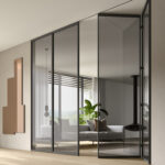 Porta in vetro con apertura a libro Skyline V_Open per zona giorno